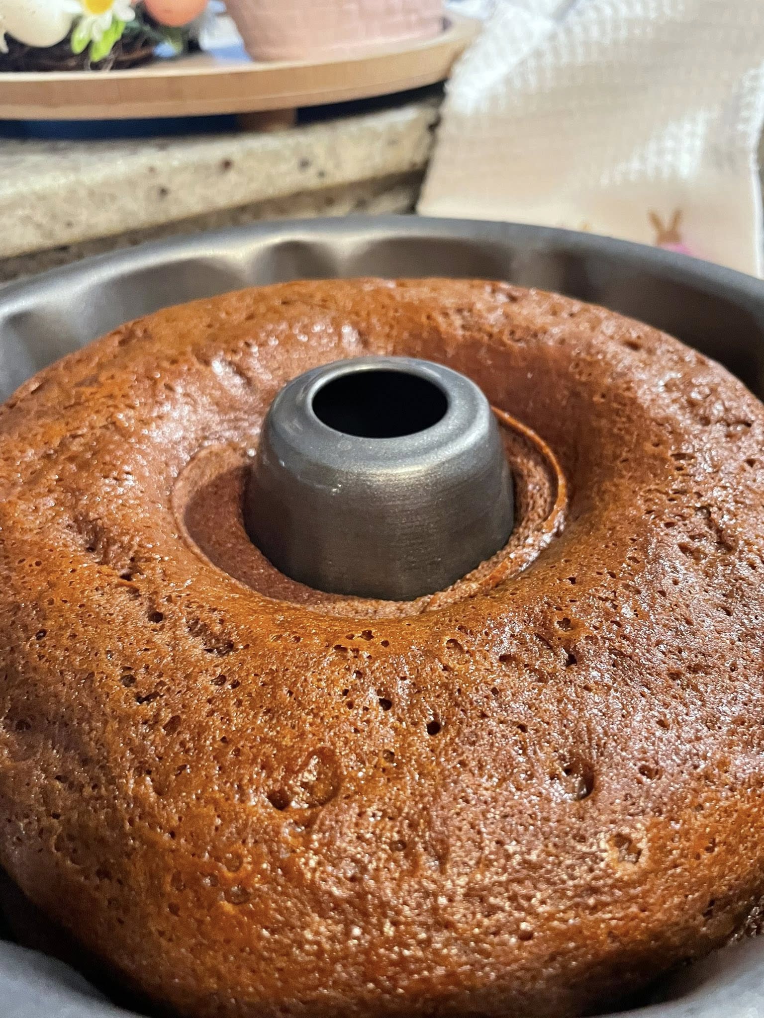 Old fashioned gingerbread cake fully baked in Bundt pan.