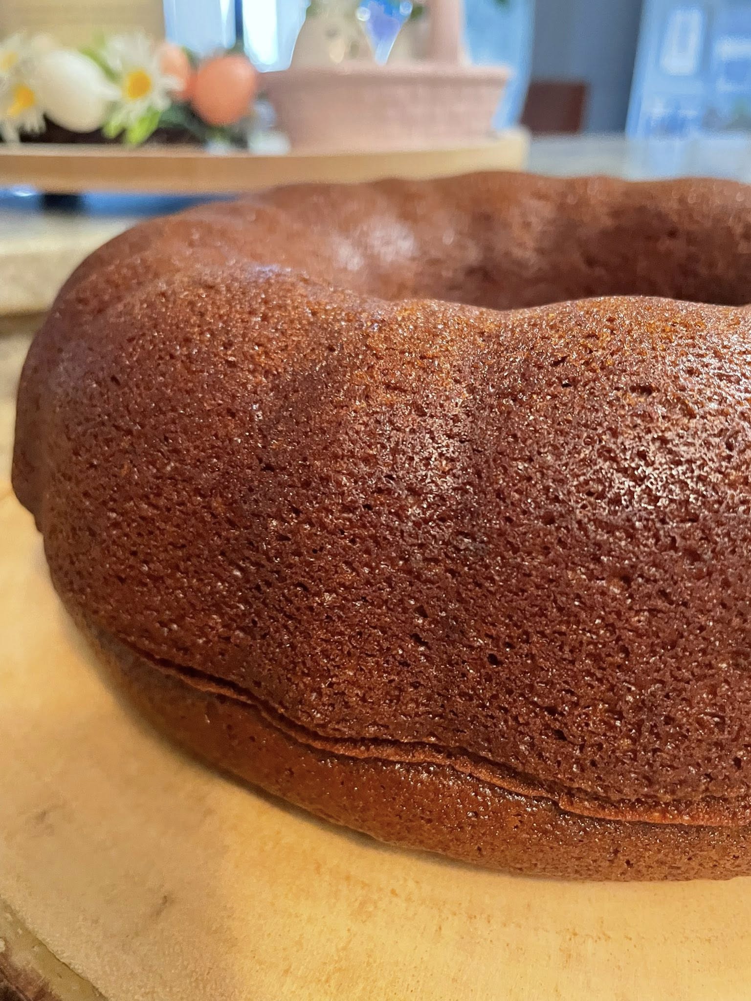 Moist molasses gingerbread bundt cake cooling on board