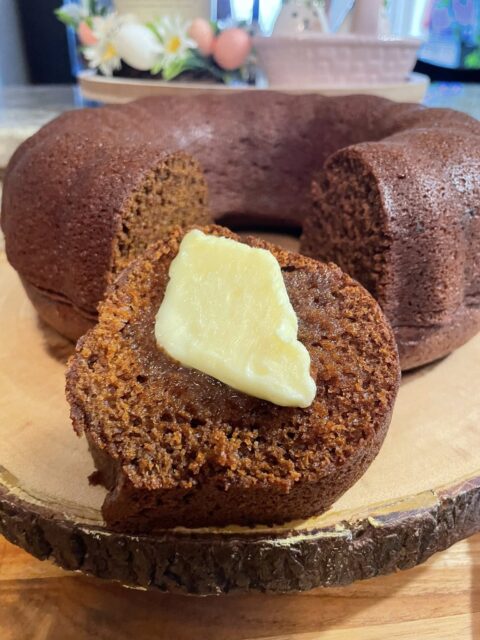 Slice of one bowl gingerbread bundt cake with melting butter