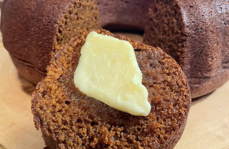 Slice of one bowl gingerbread bundt cake with melting butter