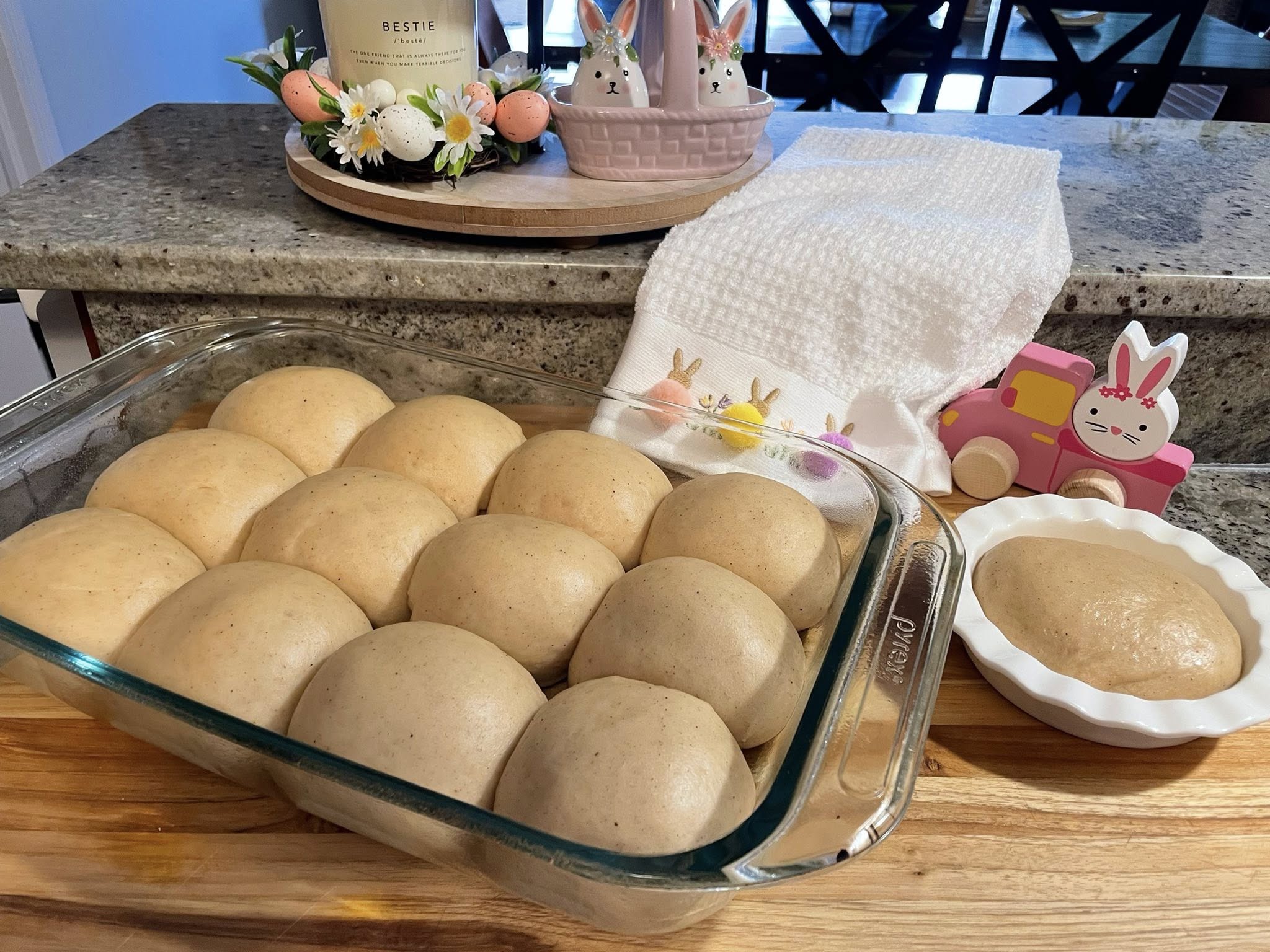 Shaped buns doubled and touching in pan.